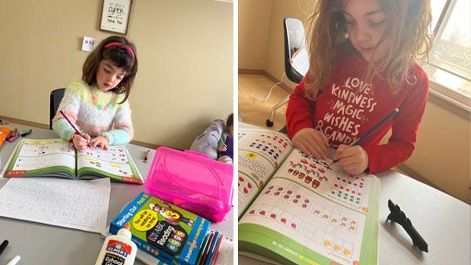 Homeschooled Kindergarten [Reception] girl learning with Reading Eggs workbooks.