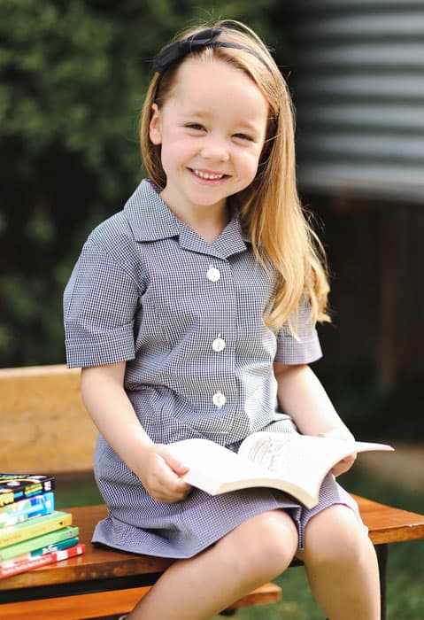 Reception child enjoying learning to read.