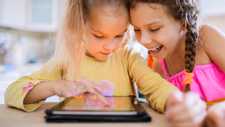 Girls playing on ipad